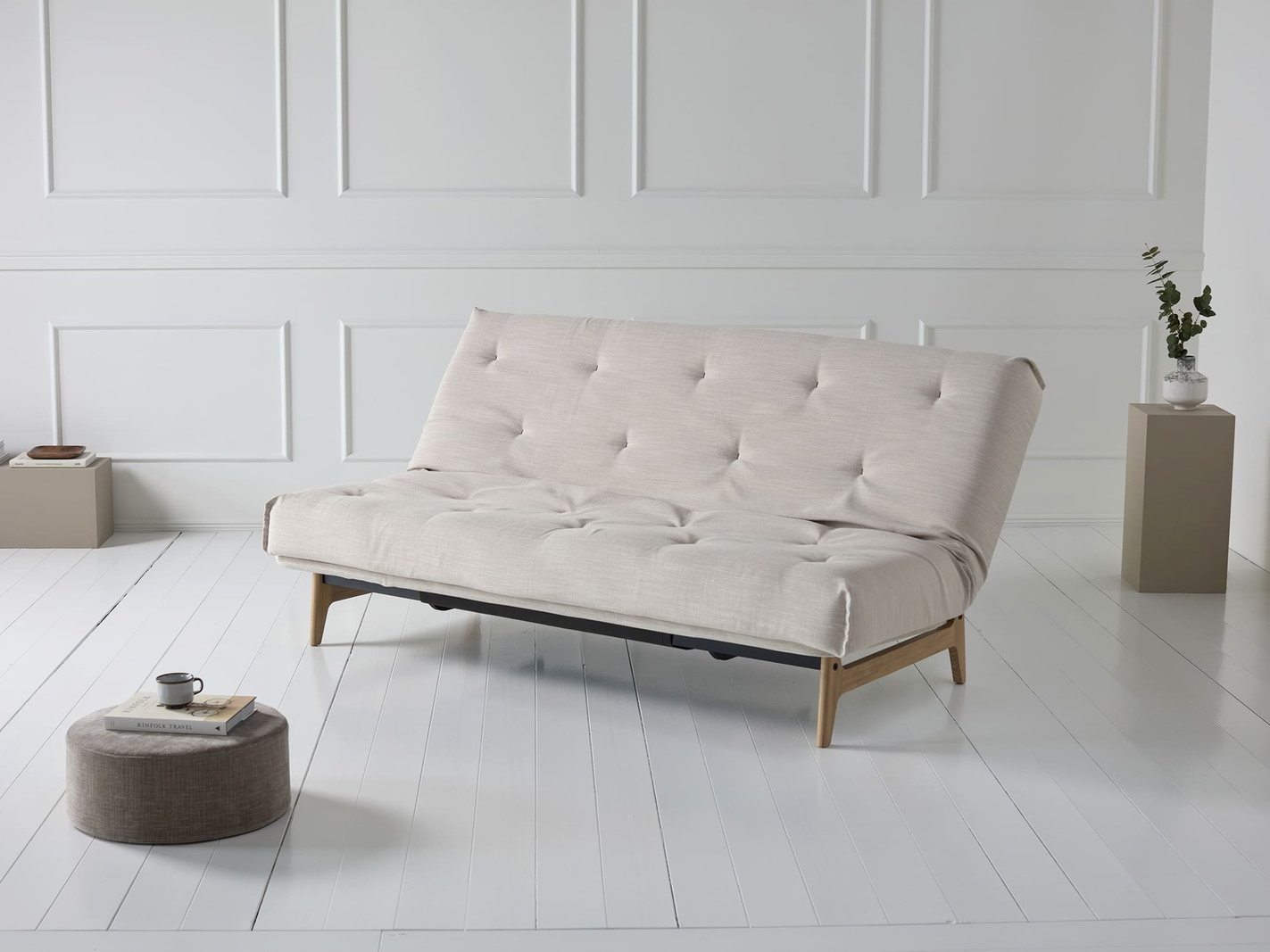Canape convertible Aslak en lit fait avec couette et oreillers